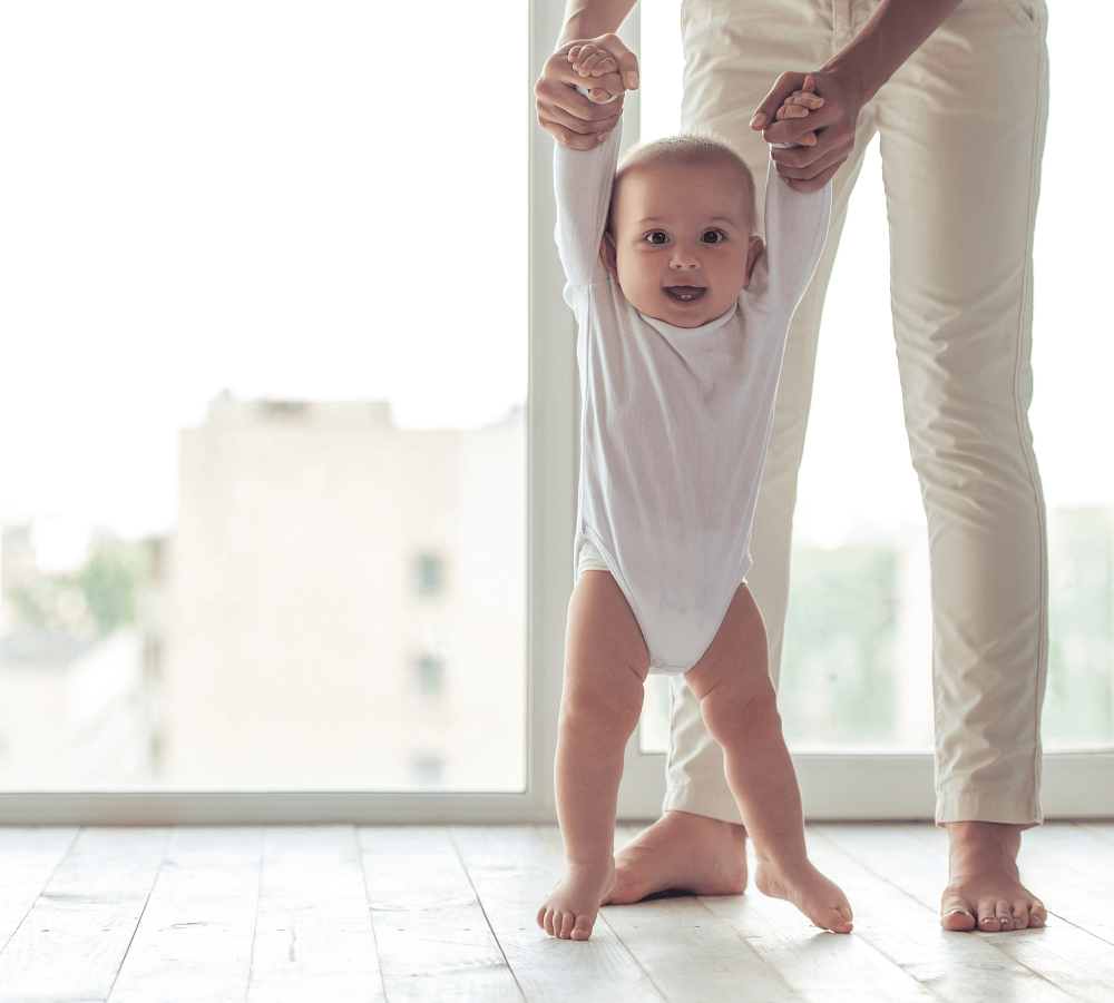 When do babies stand their own?