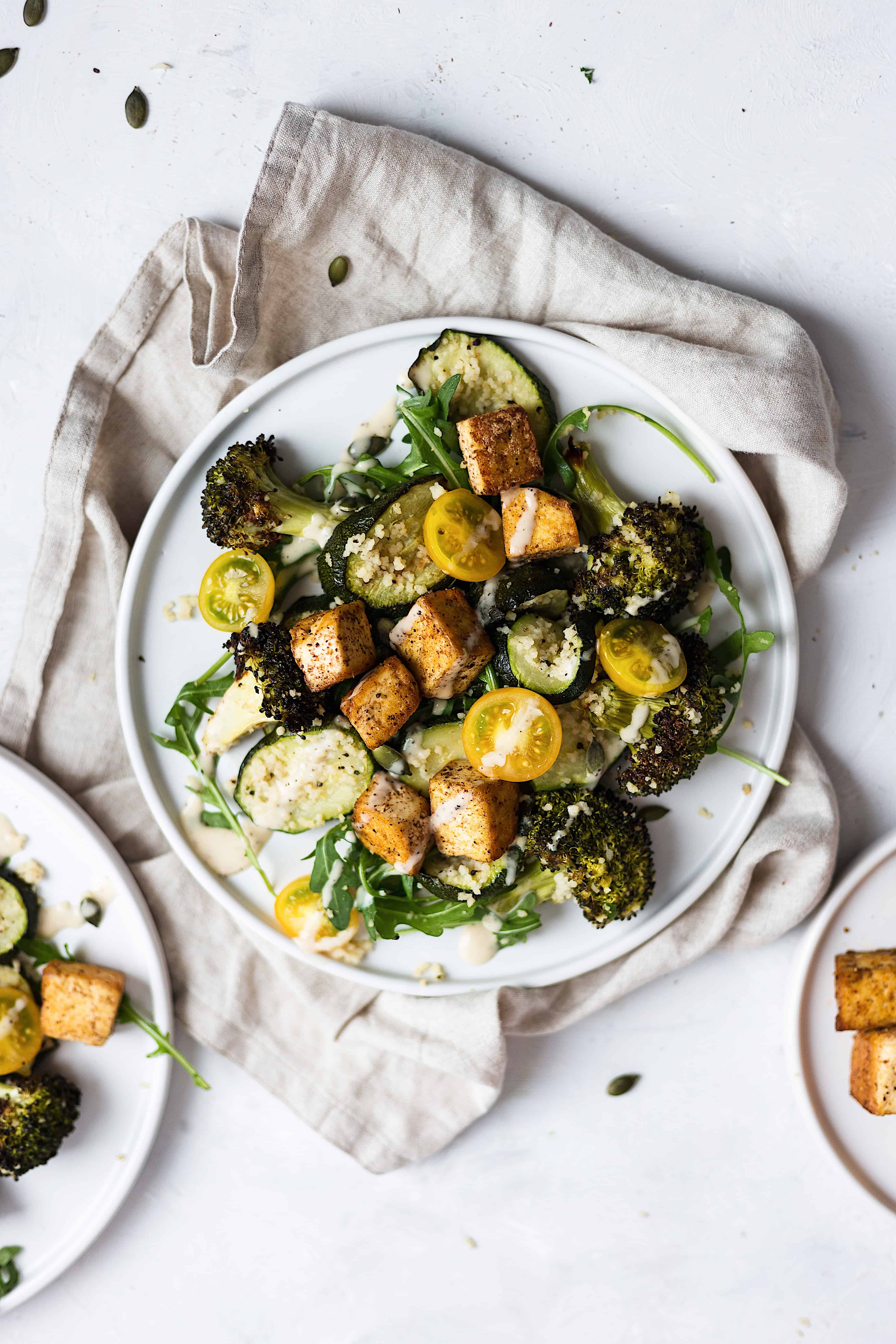 vegan courgette, broccoli & rocket salad with crispy jerk tofu