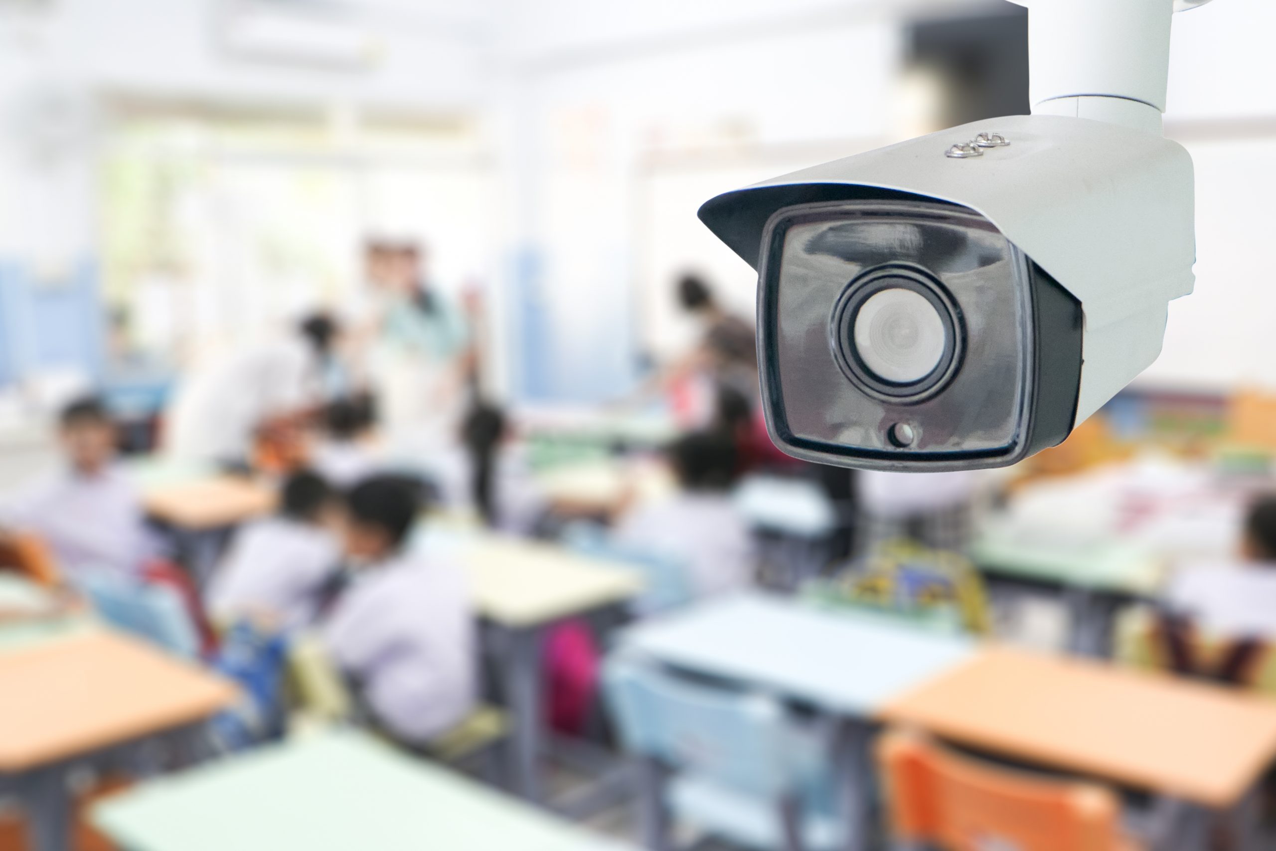 CCTV Security monitoring student in classroom at school.Security camera