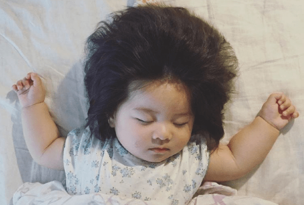&#039,She came out with a LOT of hair&#039, This baby has gone viral
