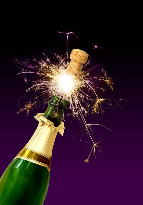 Champagne bottle cork popping with sparkling fireworks Stock Photo