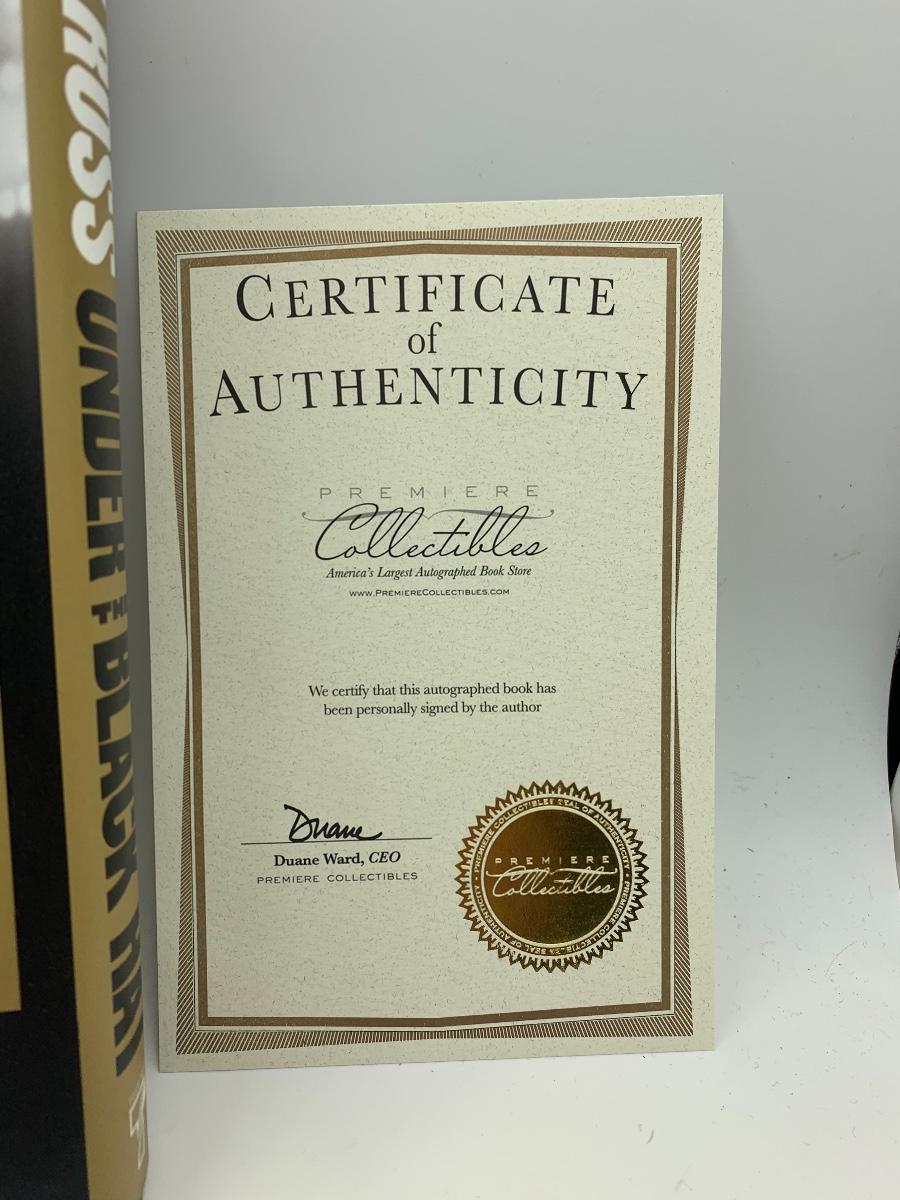 Autographed “ under the black hat“ Jim Ross Book with COA