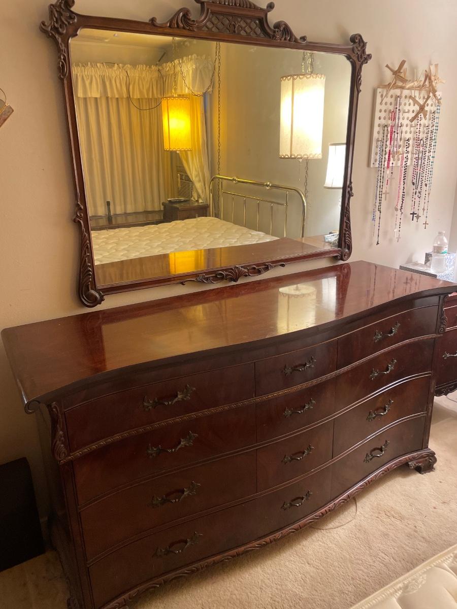 12 drawer vintage wooden dresser with mirror on wall