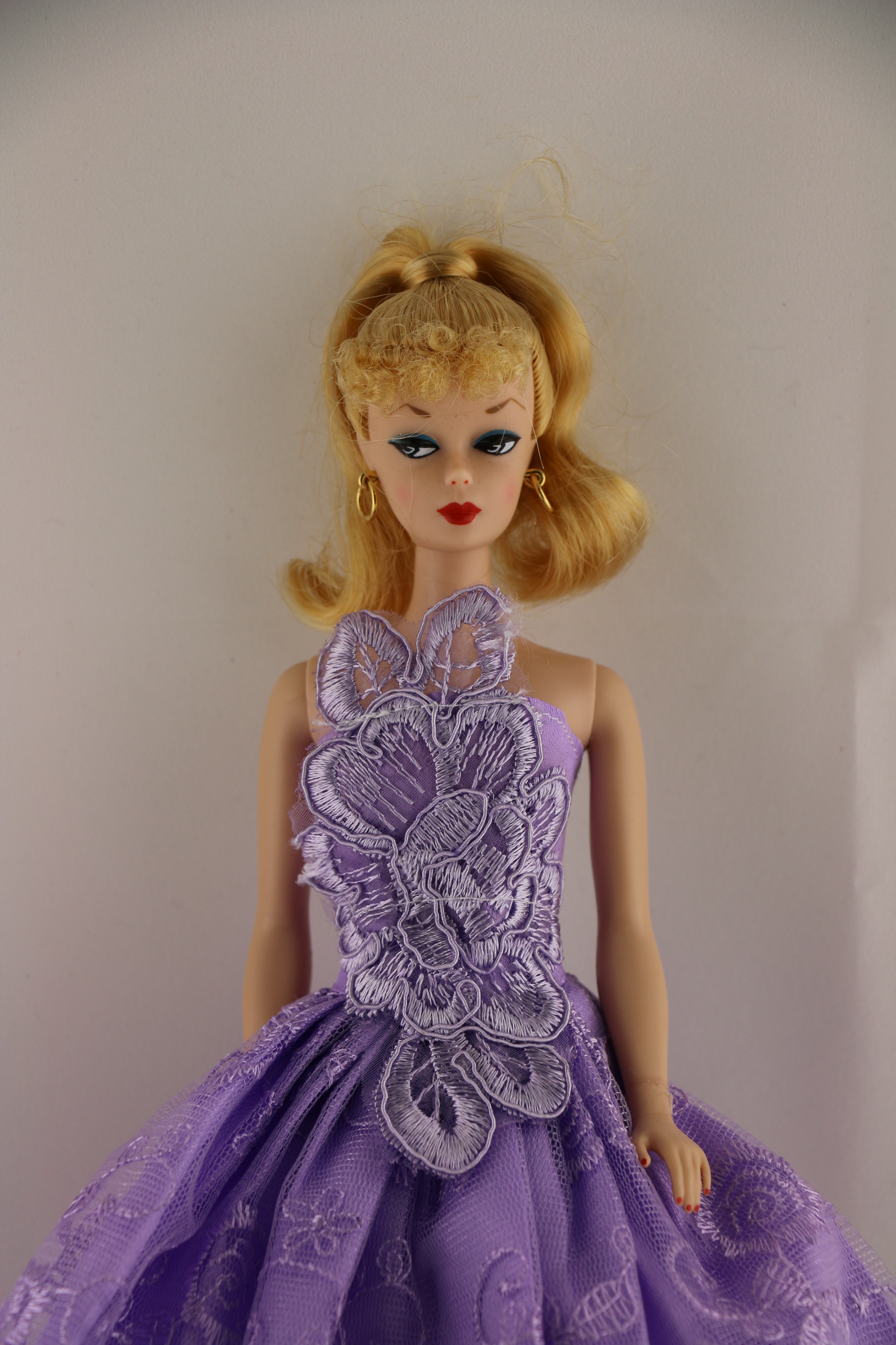 A Little Purple Dress with a Large Floral Botice Made to Fit Barbie