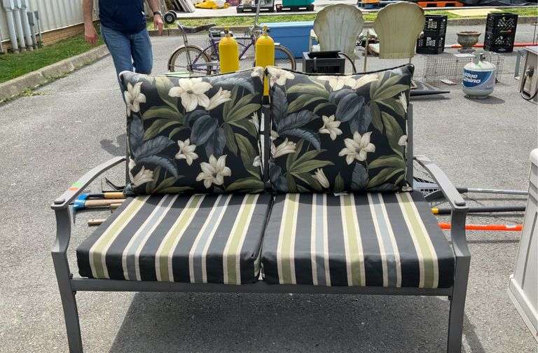 Metal frame patio loveseat with floral pillows,47”sitting Hash Auctions