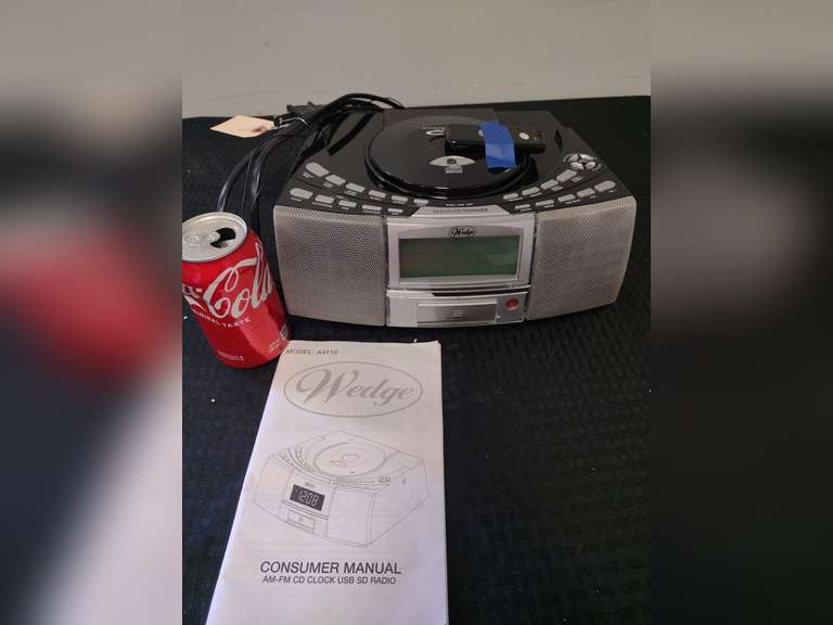 Wedge AM/FM, CD, USB, SD, alarm clock radio powered on when tested