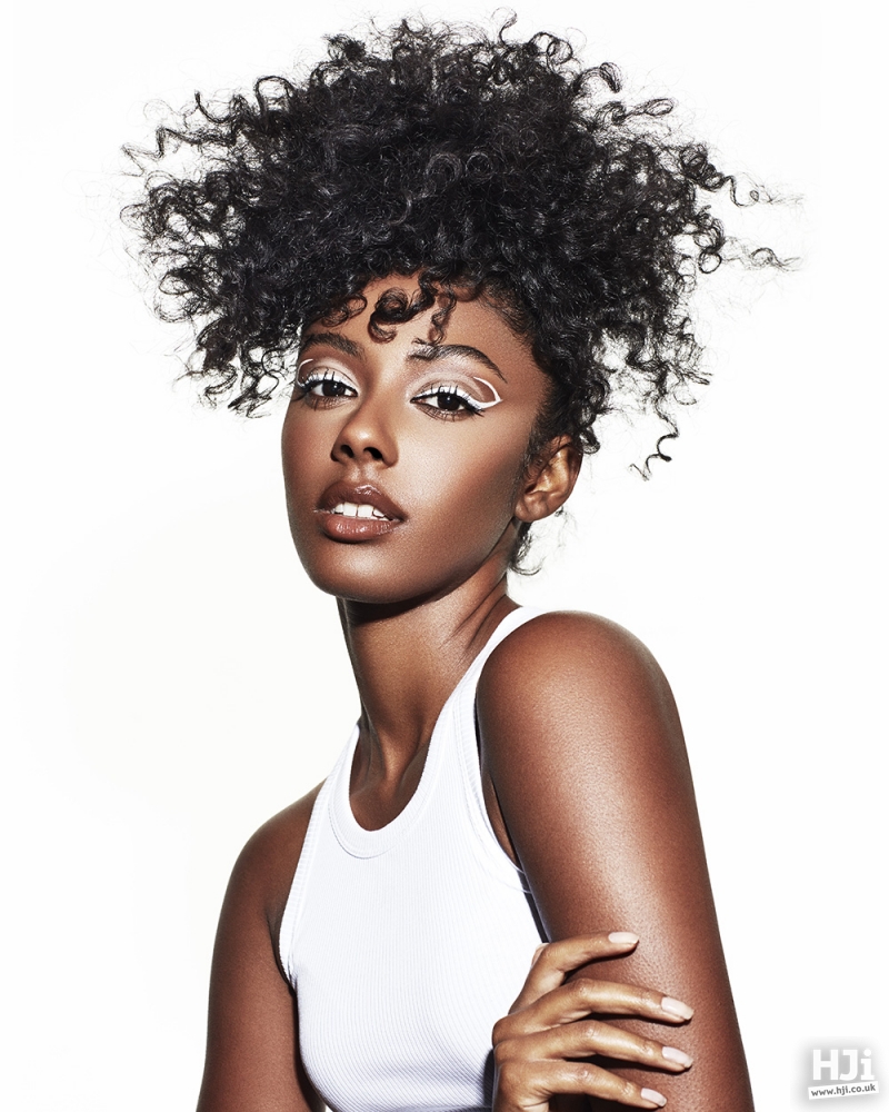 Midlength Afro top knot updo