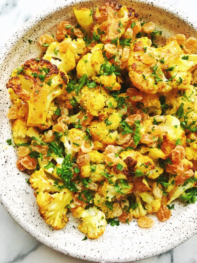 Curry Turmeric Roasted Cauliflower with Golden Raisins and Parsley
