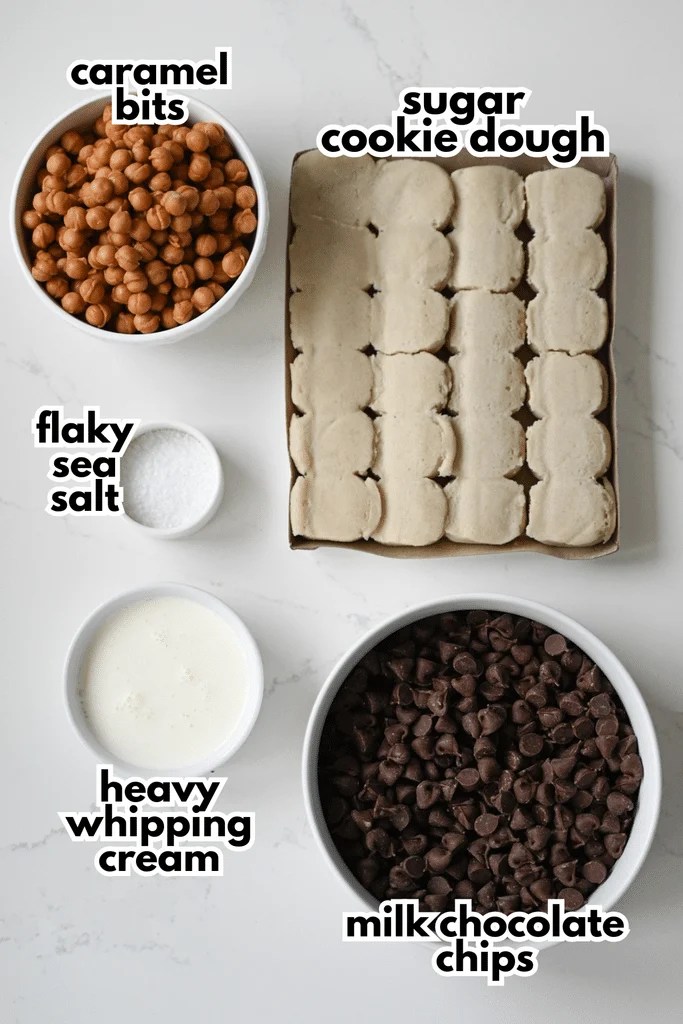 The ingredients needed to make Twix Cookie Cups on a white background.