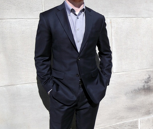 The Suggestion Blue suit, grey shirt.