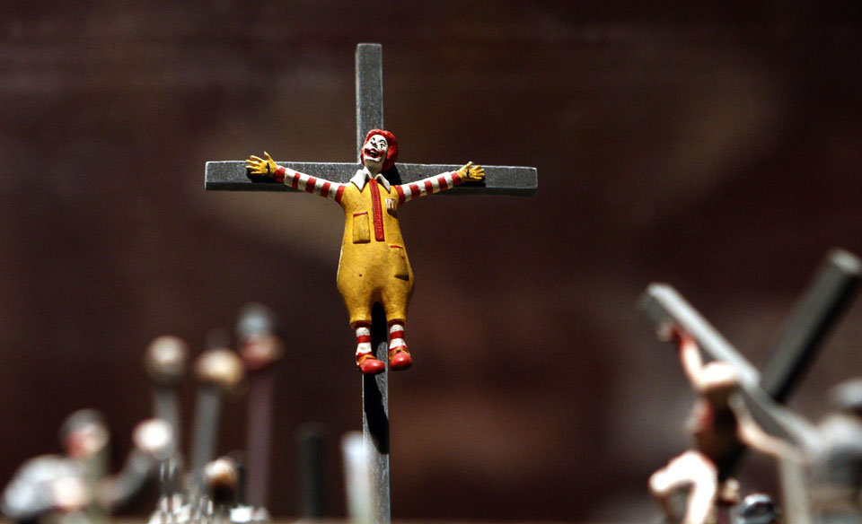A figure of a crucified Ronald McDonald