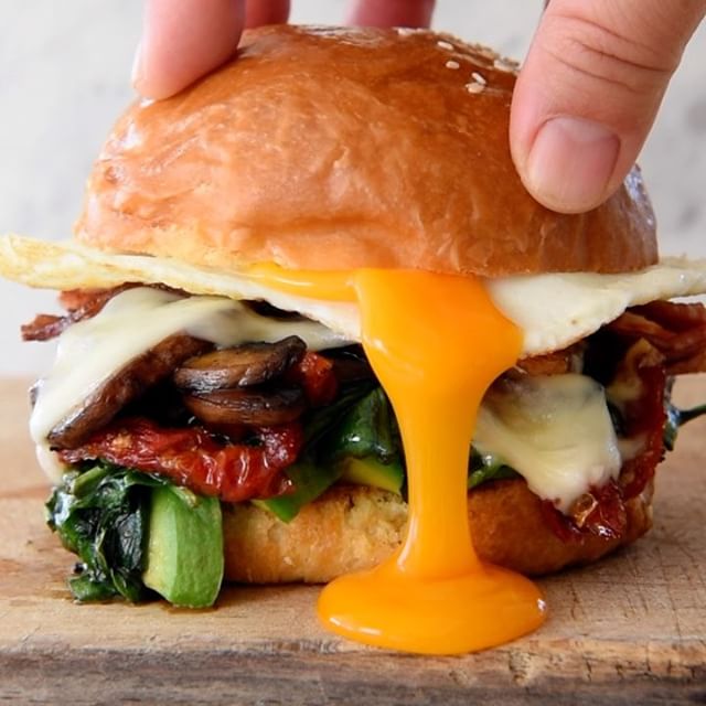 Egg Sandwich With Mushrooms, Avocado, Bacon, Spinach, Cheese And Sun