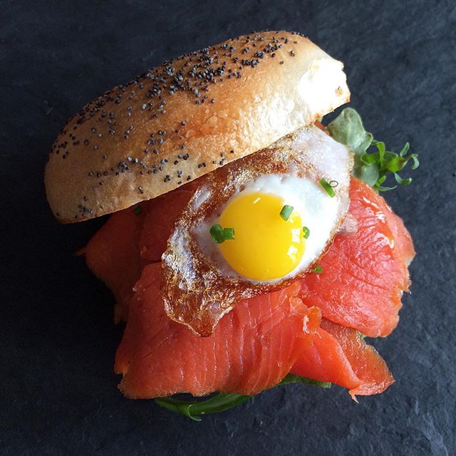 Poppy Seed Bagel, Arugula, Smoked Salmon, Fried Quail Egg, Chives
