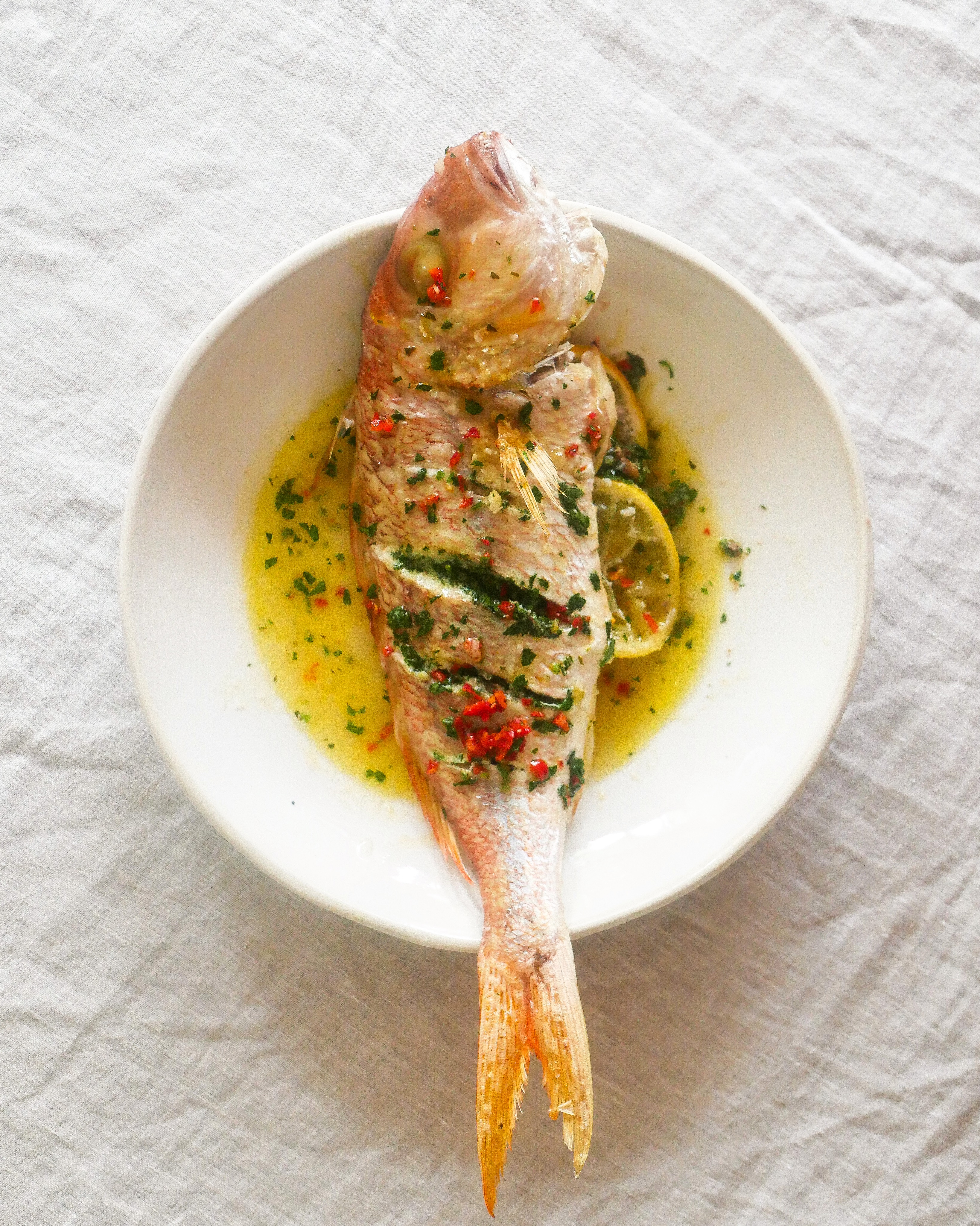 Green Anchovy Butter Lathered Whole Baked Fish The Feedfeed