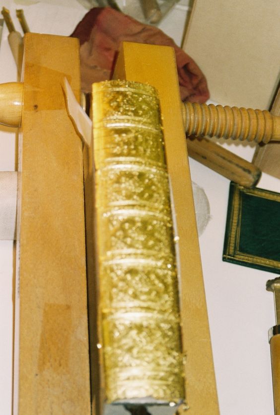 Gold tooling with gold leaf on leather. David Ashley Studio