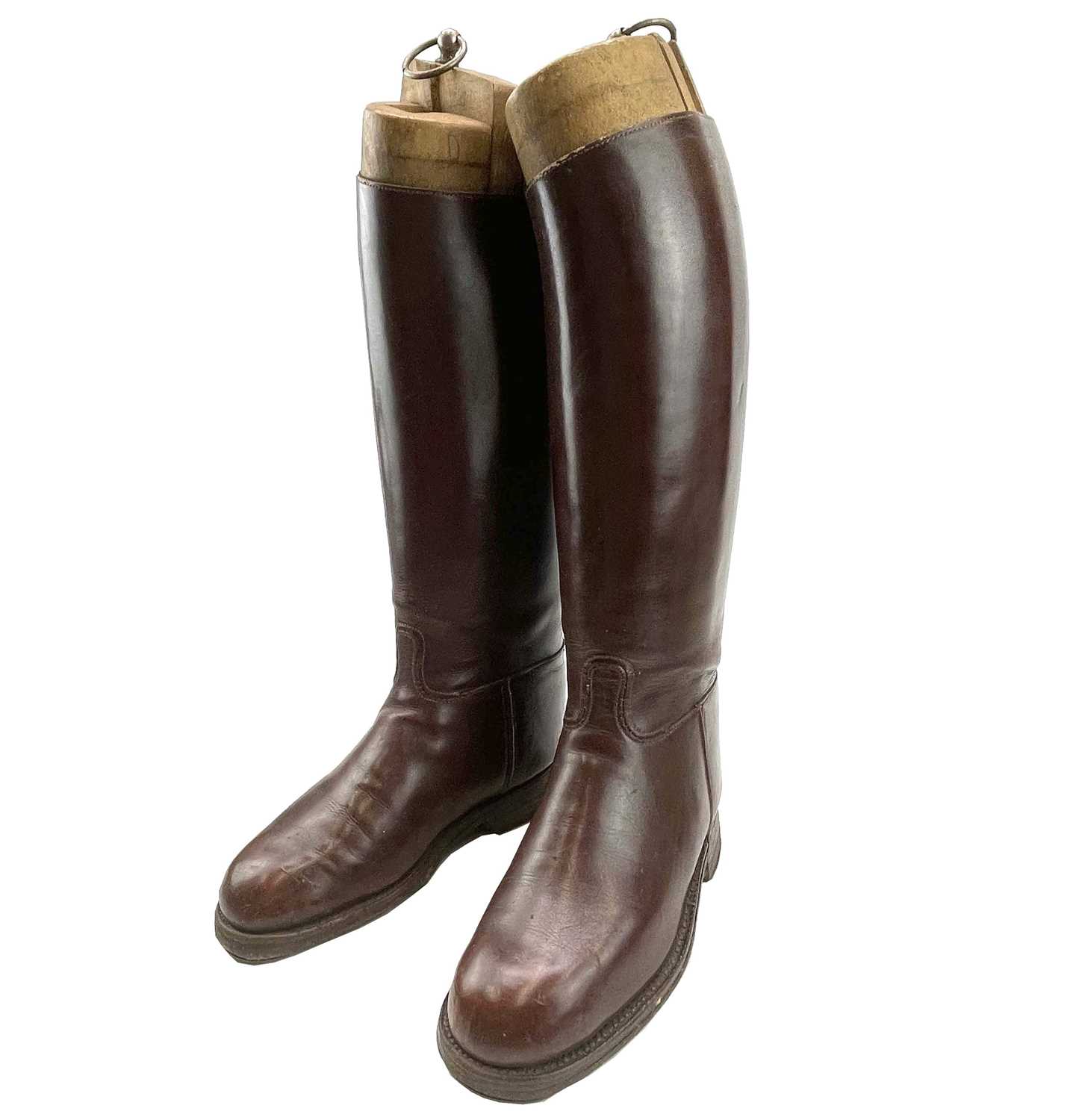 Lot 59 A pair of brown leather riding boots and