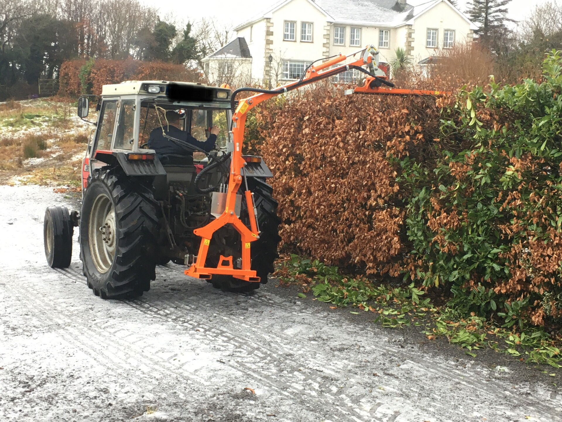 Tractor mounted garden hedge cutting David Perry Gardens