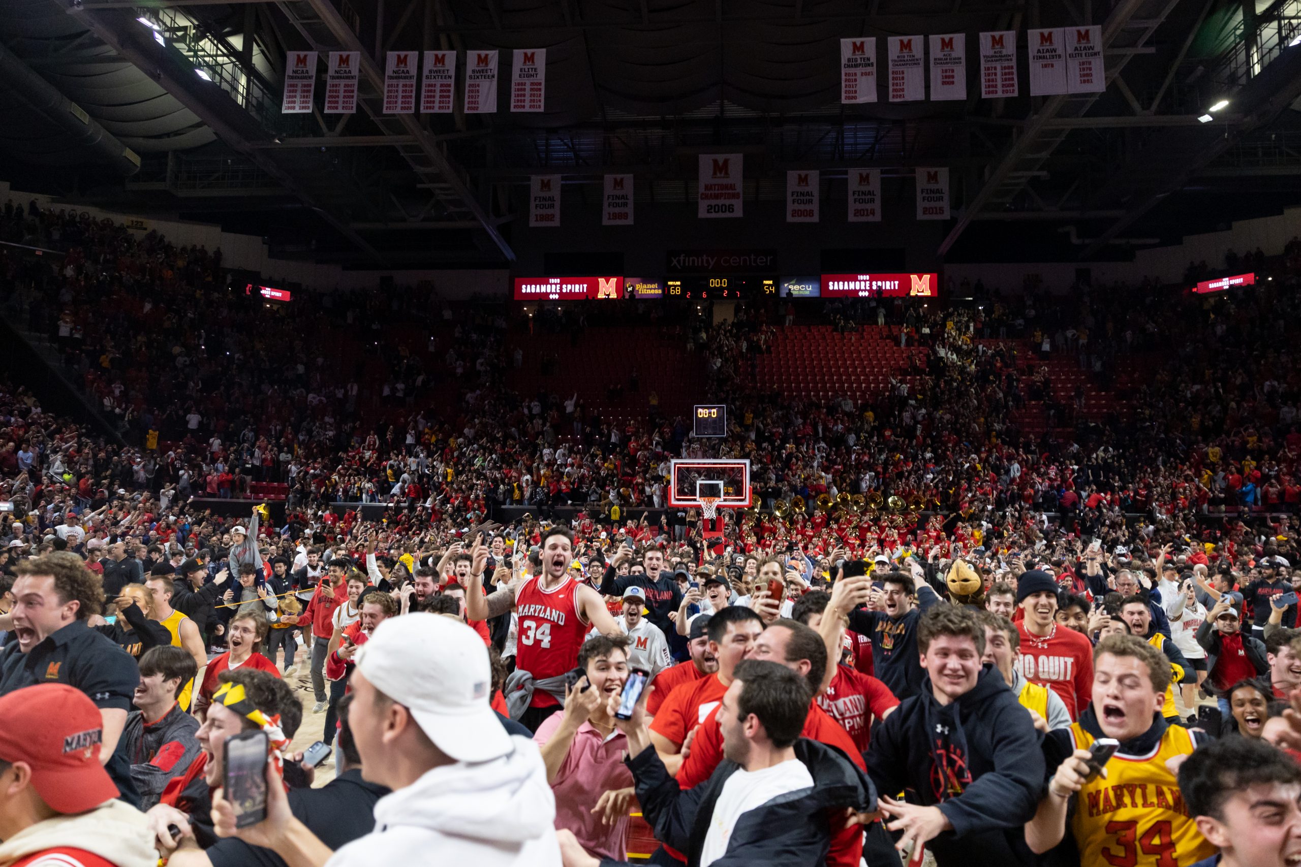 A courtstorming crowd celebrated the first signature moment of the