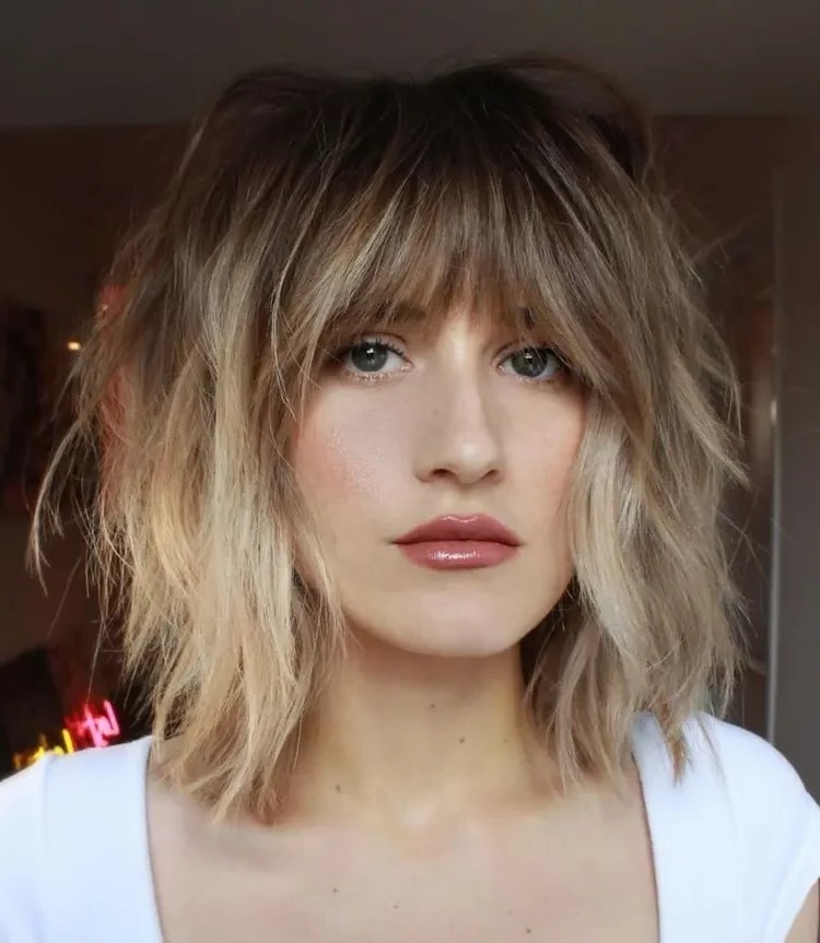 Bottleneck bangs are totally trendy in 2023! Learn how to style it properly