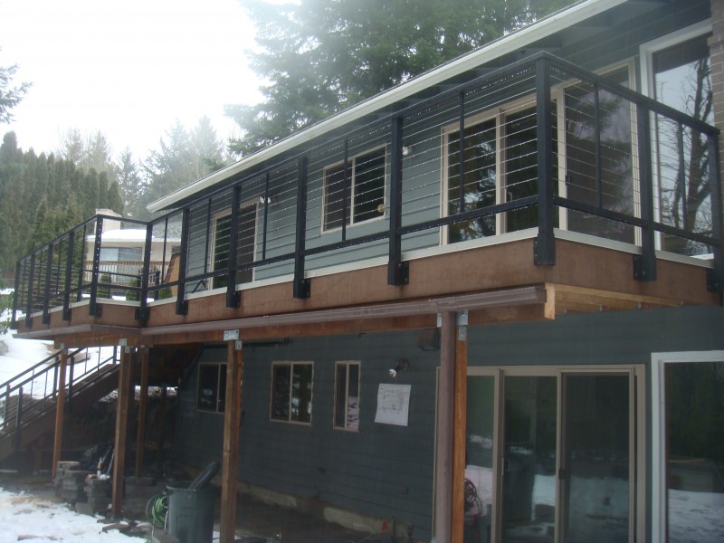 Stainless steel cable rail deck Deck Masters, LLC