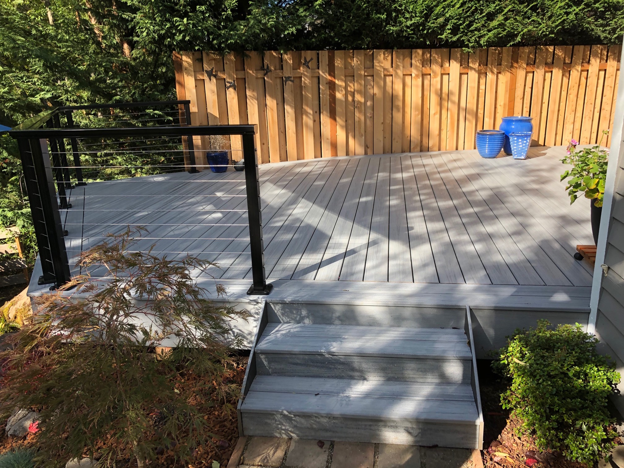 Foggy Wharf Trex deck with cable railing Deck Masters, LLC