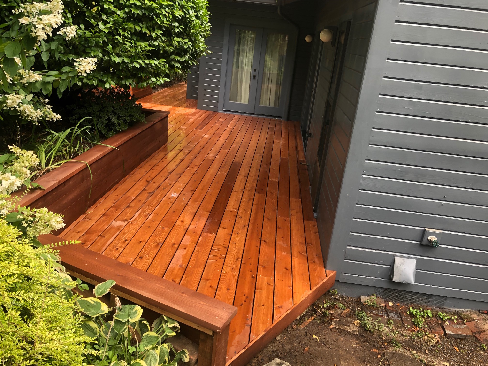 Cedar deck and retaining wall Deck Masters, LLC