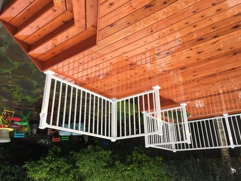 Cedar deck with aluminum railing in white Deck Masters, LLC