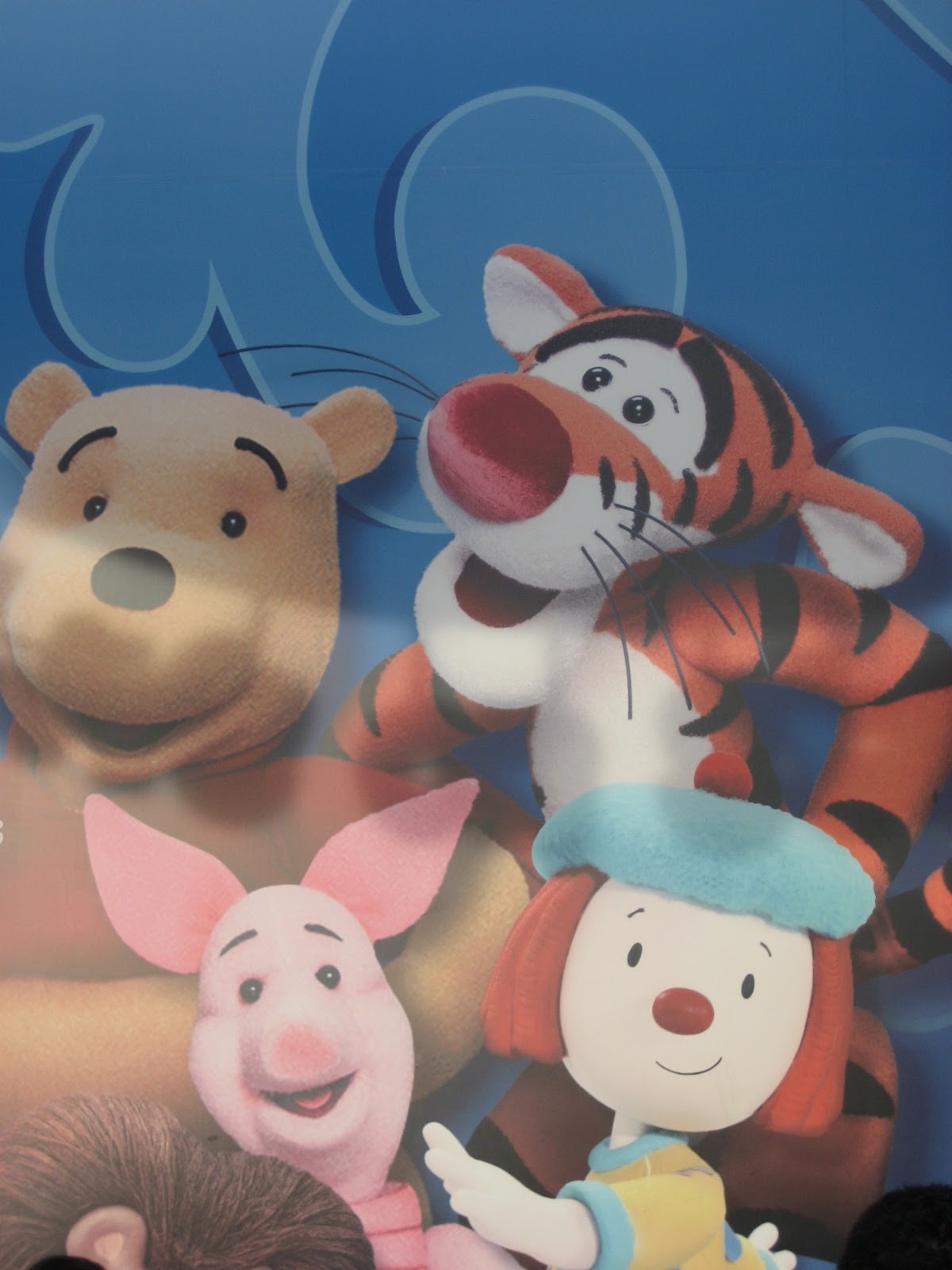 Book of Pooh Characters and JoJo on Signage for Playhouse Disney Live