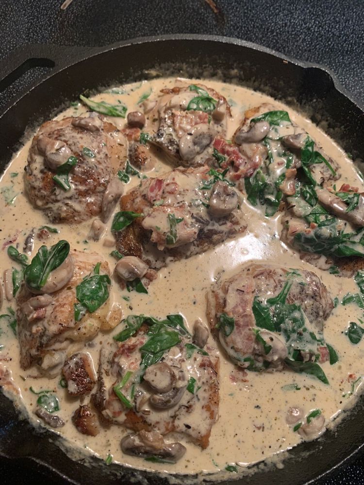 Chicken Thighs with Creamy Bacon Mushroom Thyme Sauce • Delish Club