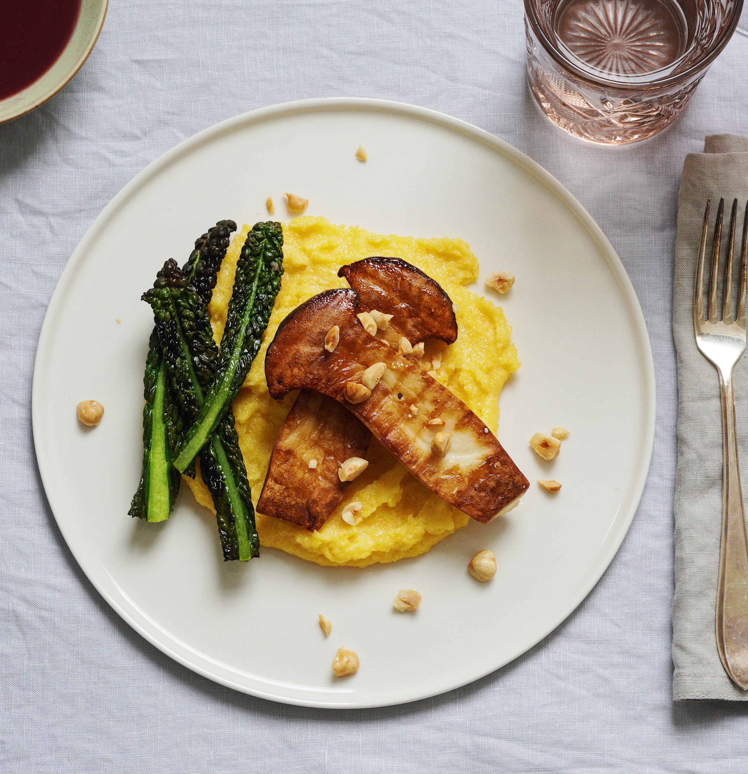 Grilled king oyster mushrooms with red wine sauce, polenta and crispy cavolo nero DELIZABETH