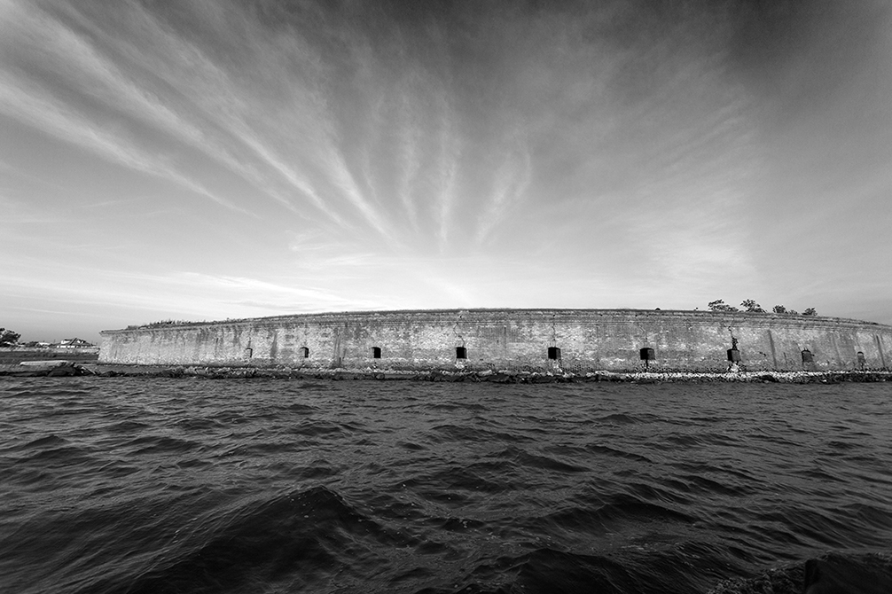 Black and white wall by water