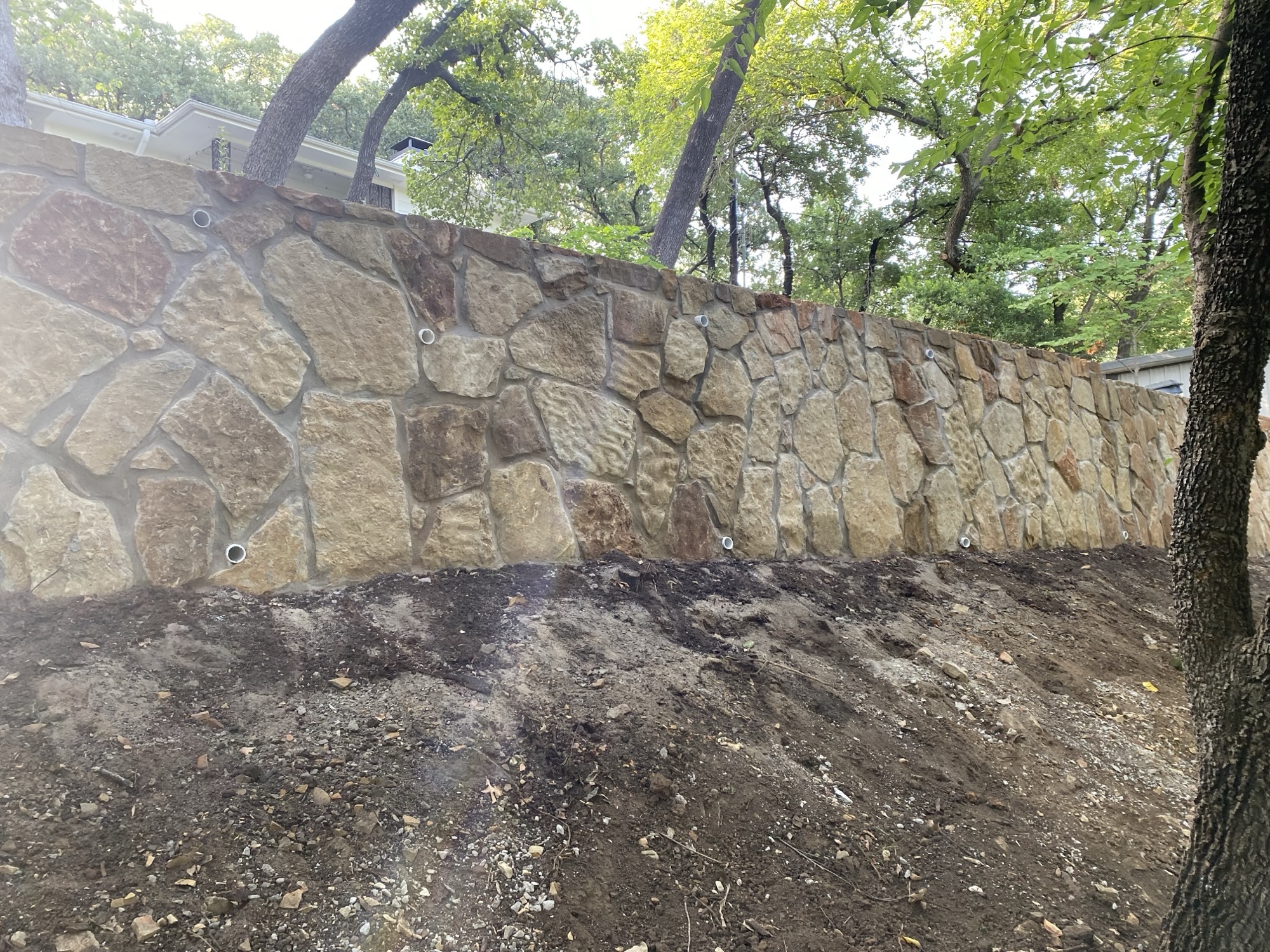 Replaced an old crosstie wall in Bedford with a new Milsap stone wall