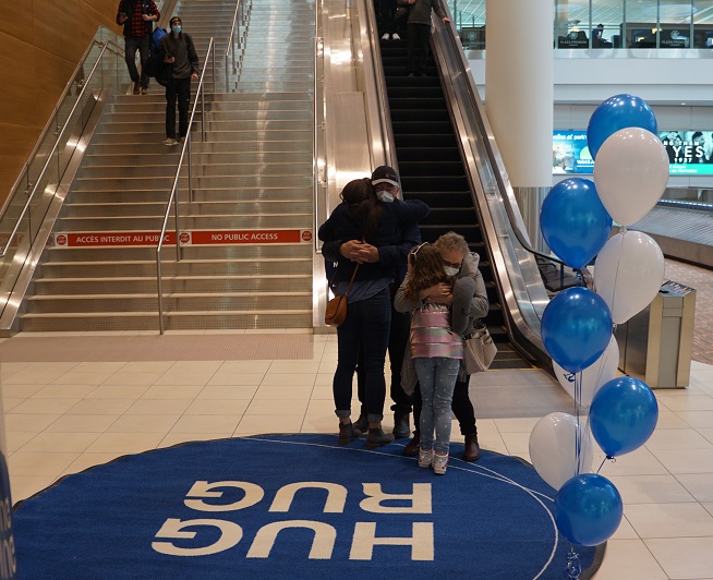 'Iconic symbol for the community' Hug rug at airport returns