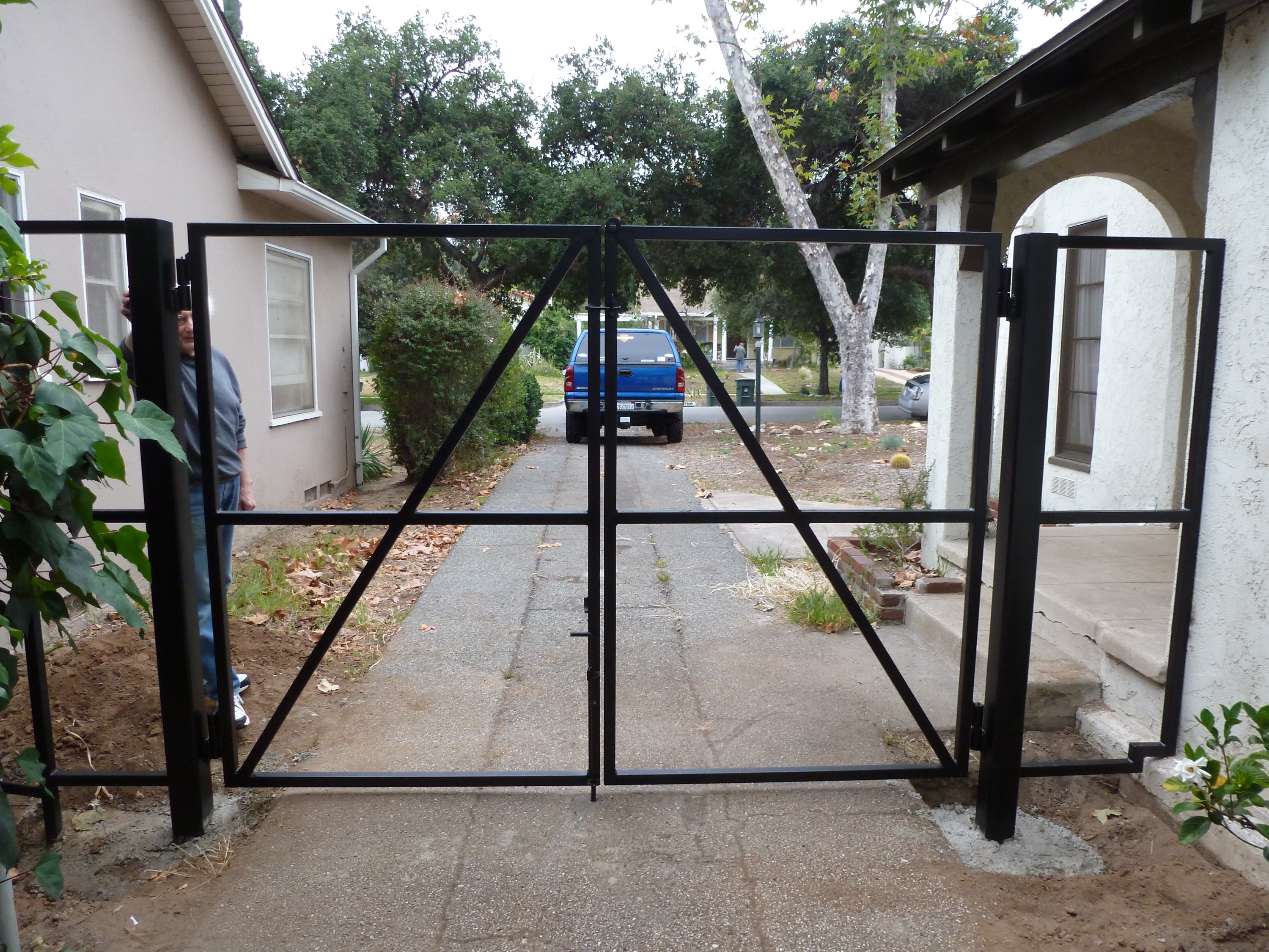 Wrought Iron frame with wood overlay Double Swing Gates Diaz Gates