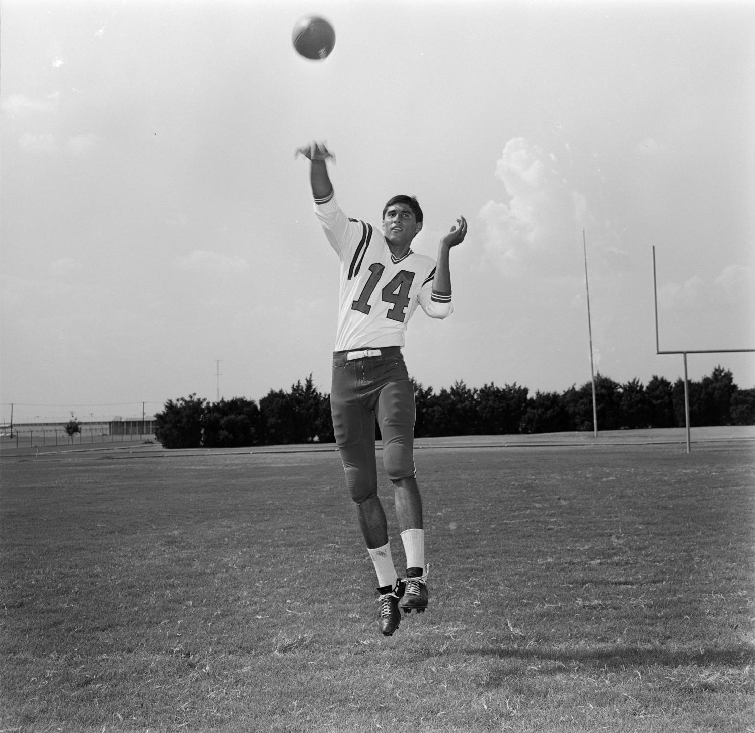 [Football player throwing a football] UNT Digital Library
