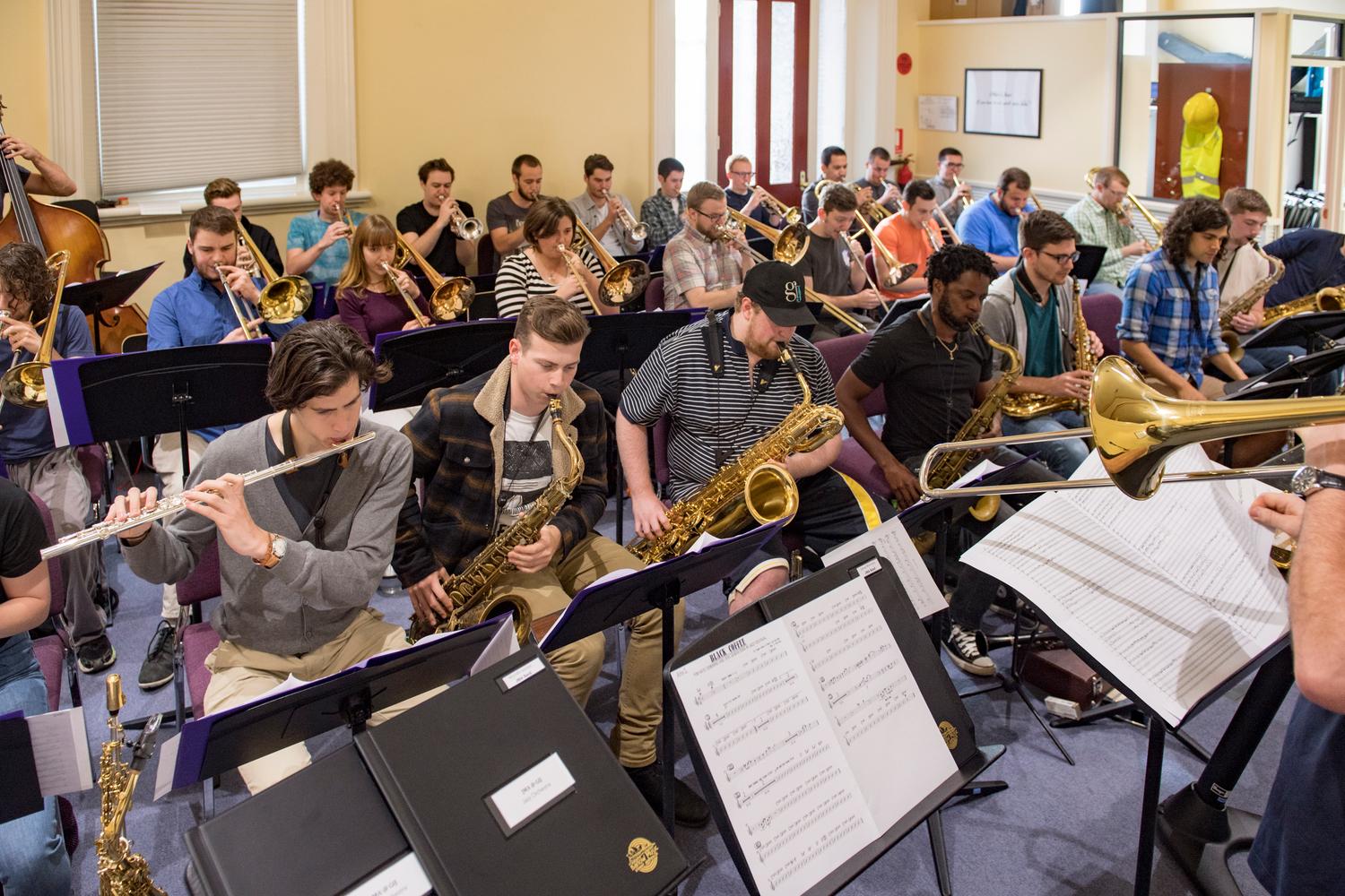 [Rows of woodwind and brass musicians performing in a room, 2] UNT Digital Library