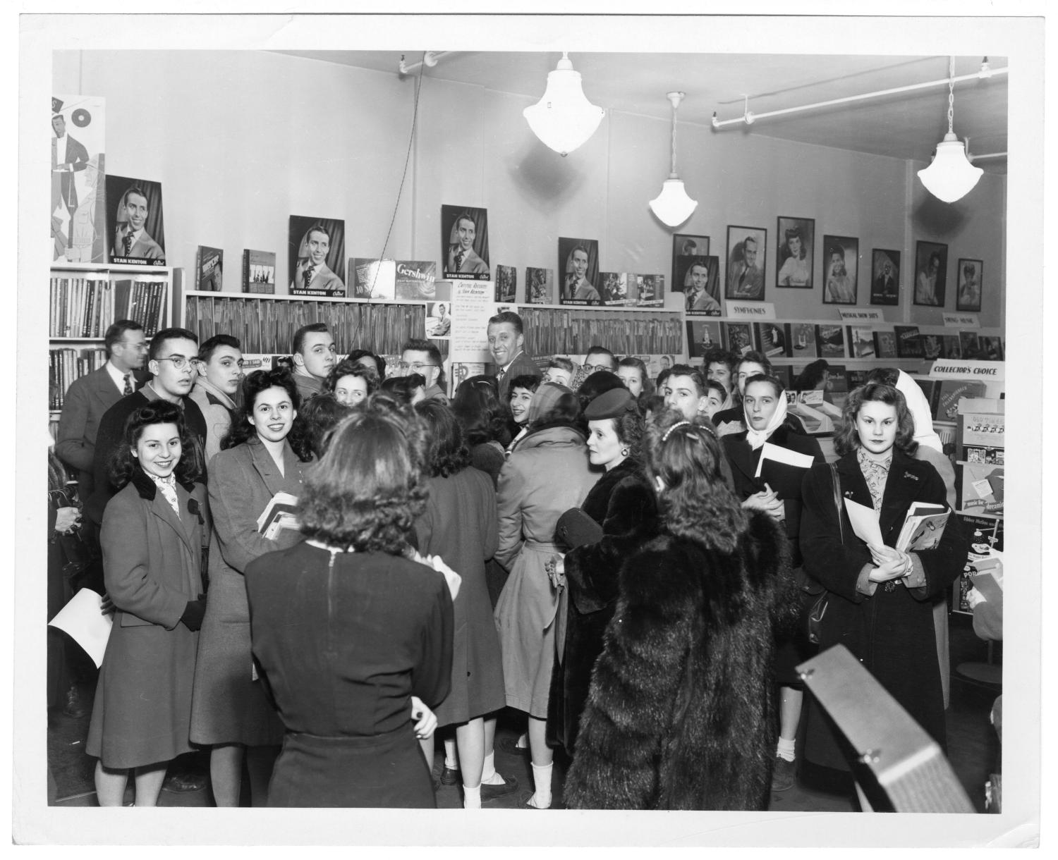 [Kenton at record store with fans] UNT Digital Library