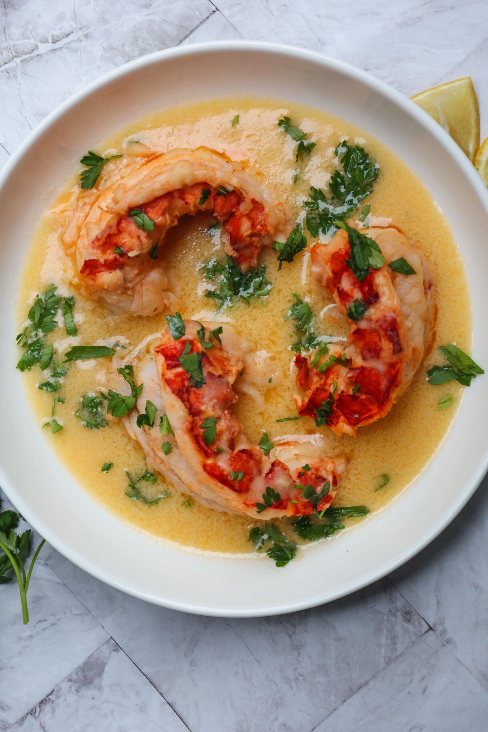 HerbInfused Butter Poached Lobster Tails with a Creamy White Wine