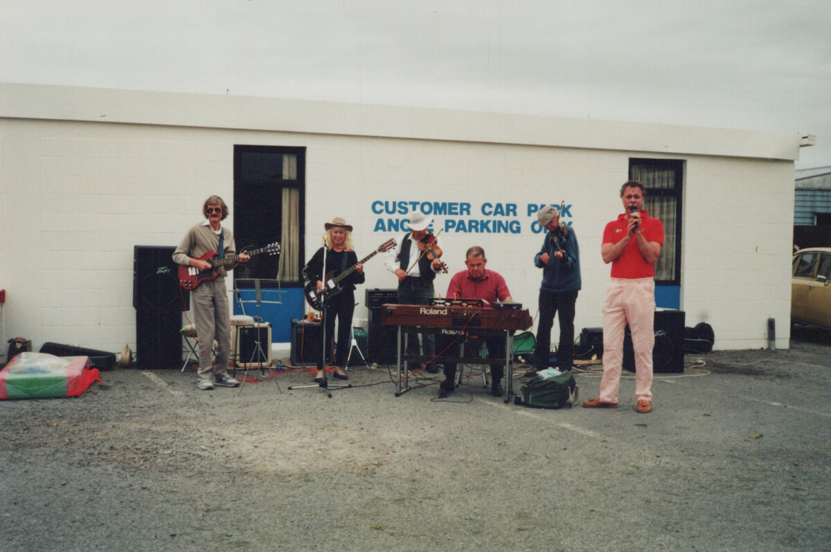 Members of the “Turkey Buzzard” band performing in an...