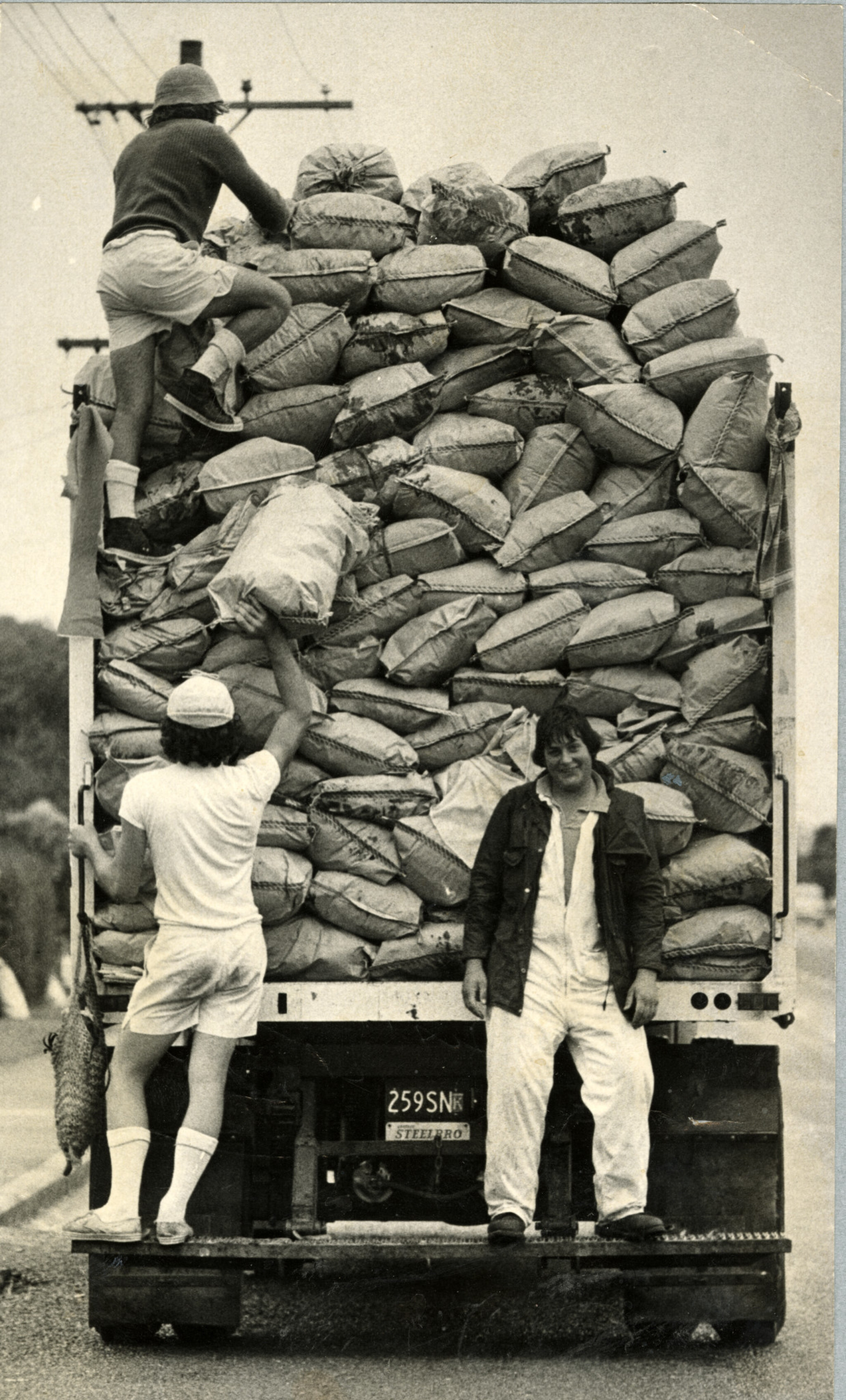 Rubbish collection truck and crew Picturing Canterbury Christchurch