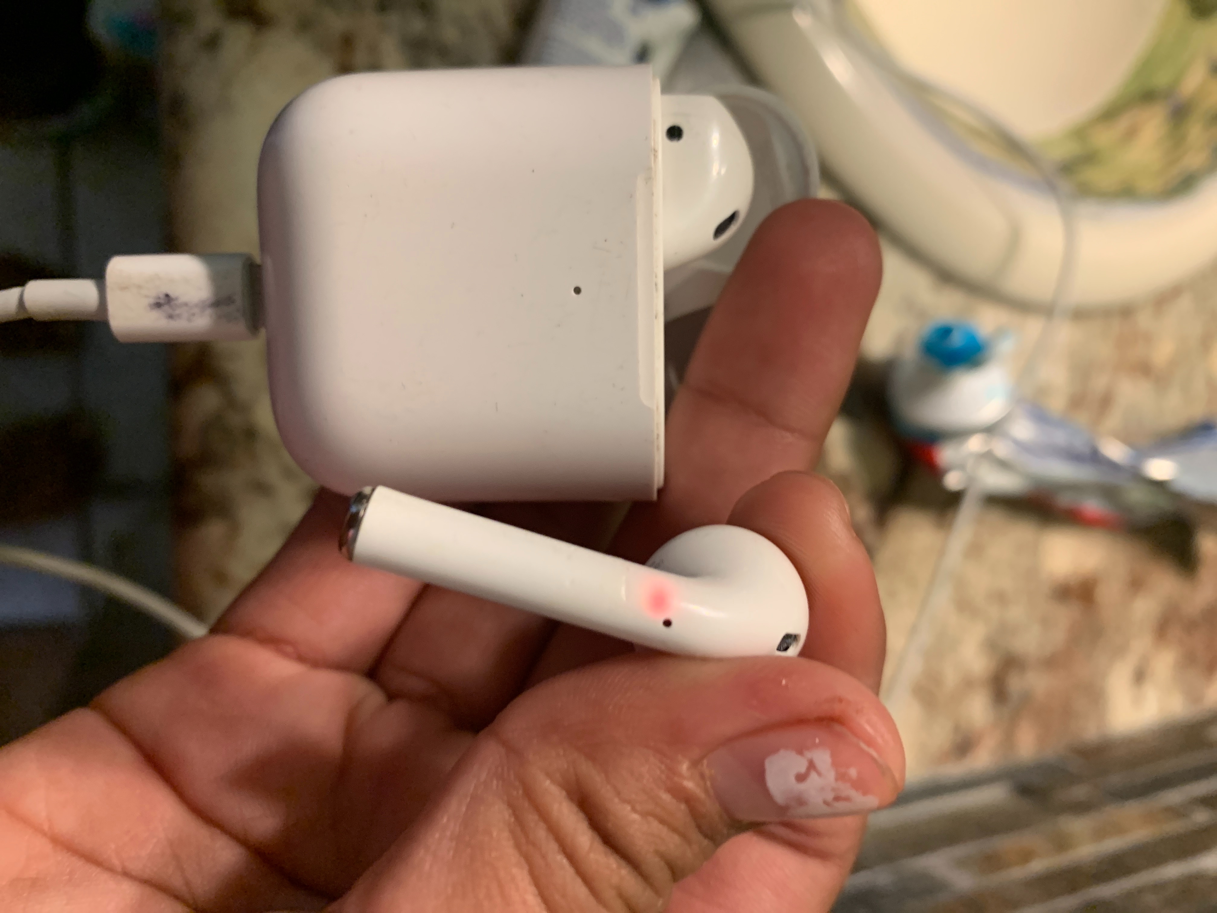why does one AirPod have a red light Apple Community