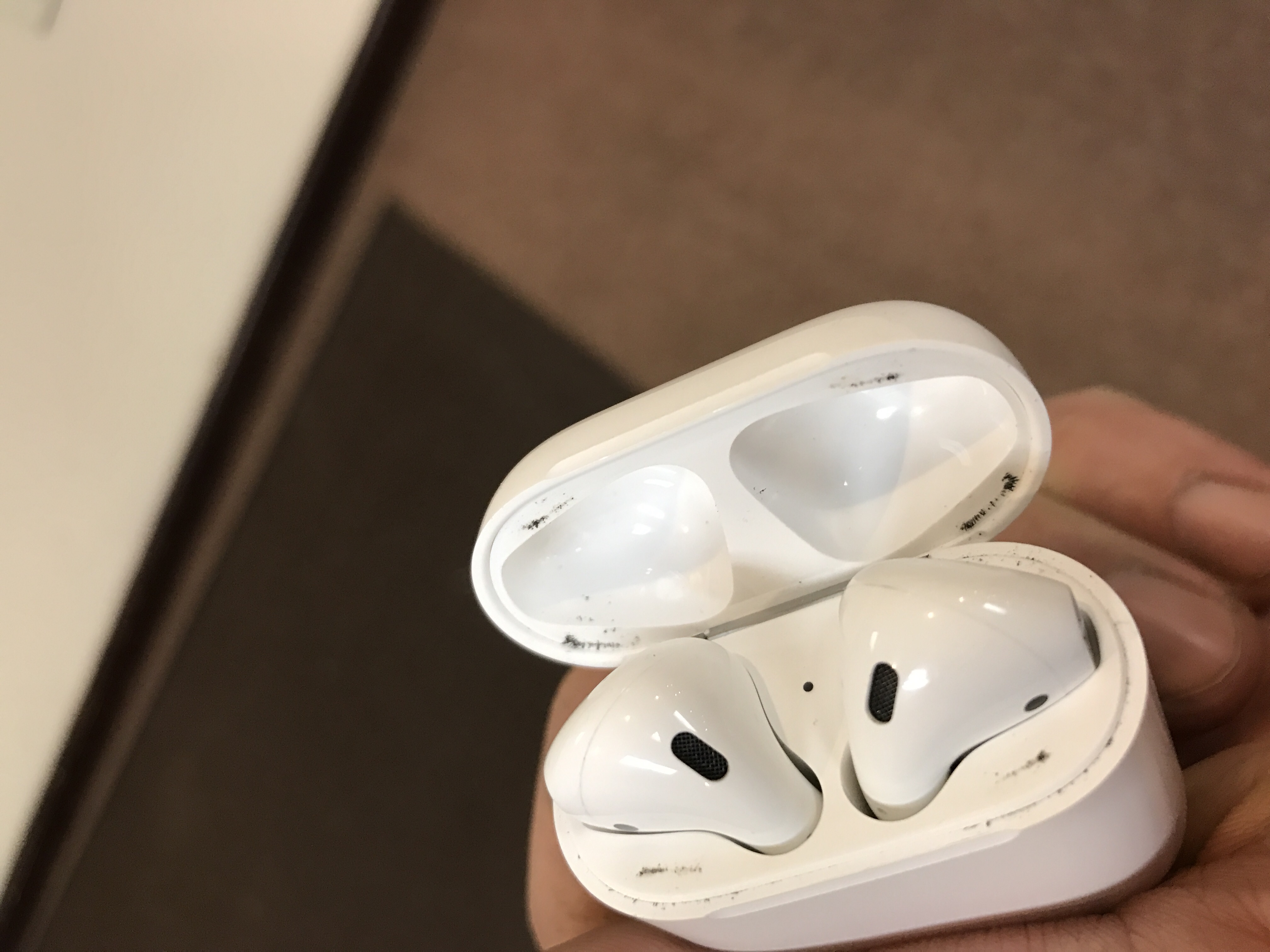 Metal shavings stuck to Airpods case Apple Community