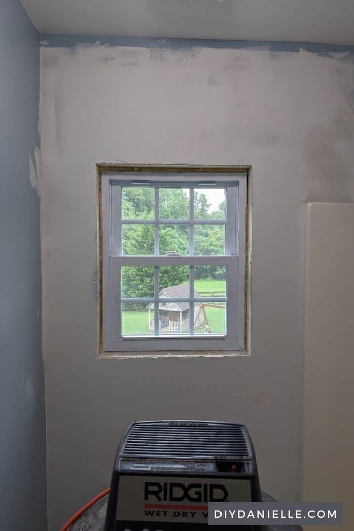 Once the space is ready, the window can be placed and attached. There