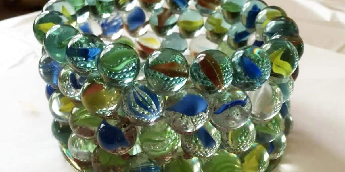 Watch How She Makes A Prism Candle Holder Out of Marbles And A CD!