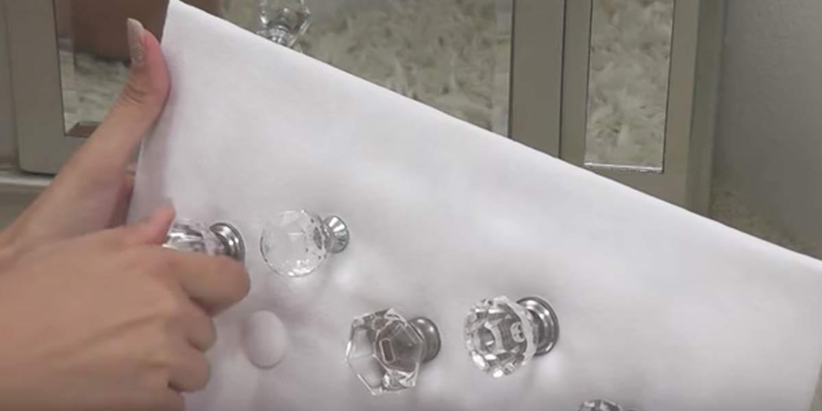 Attach Glass Knobs To A Fabric Covered Peg Board To Make This Jewelry