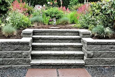 Concrete cinder block walls are sturdy and easy to build, but they can often be unattractive when compared with the rest of your home. Capping An Interlocking Block Retaining Wall