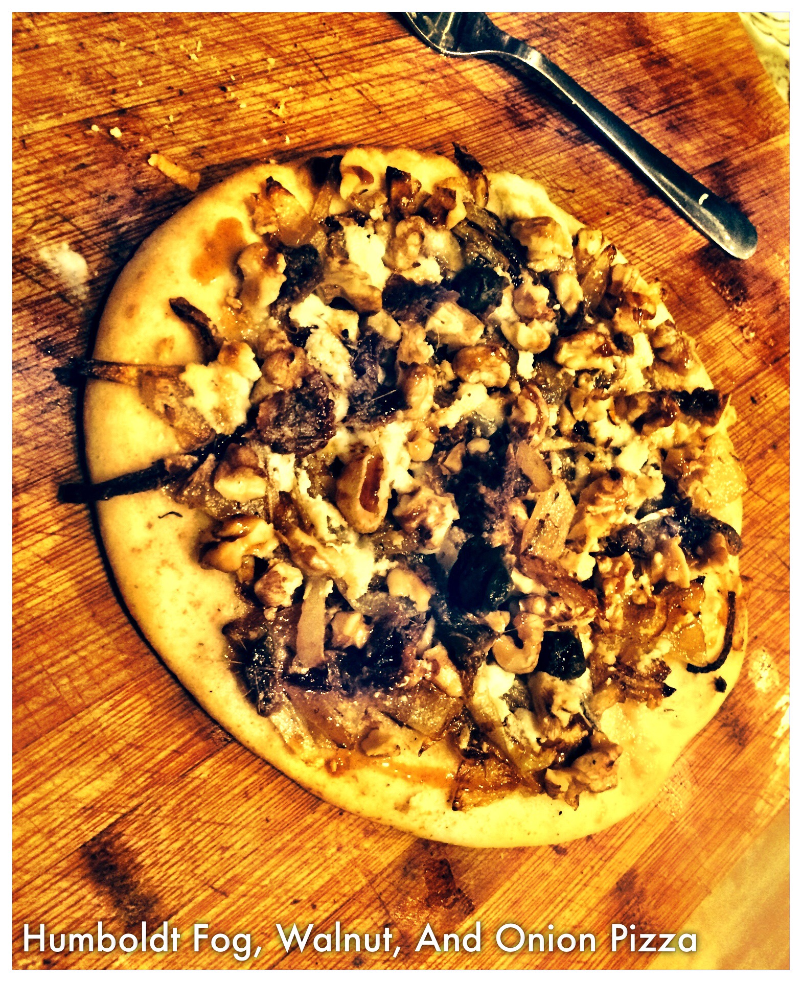 Humboldt Fog, Toasted Walnut, Caramelized Onions, and Anchovy Pizza with Pomegranate Molasses