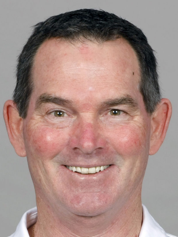 Coach Zimmer Gets Ready for Work. [DOOR FLIES OPEN]