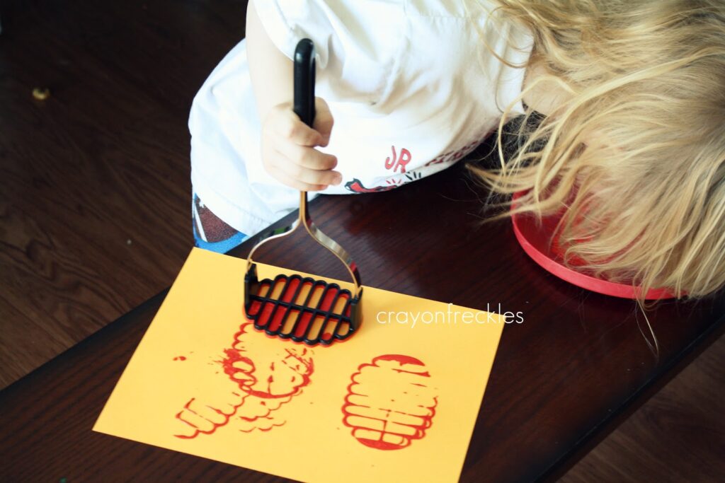 painting with a potato masher Do Play Learn