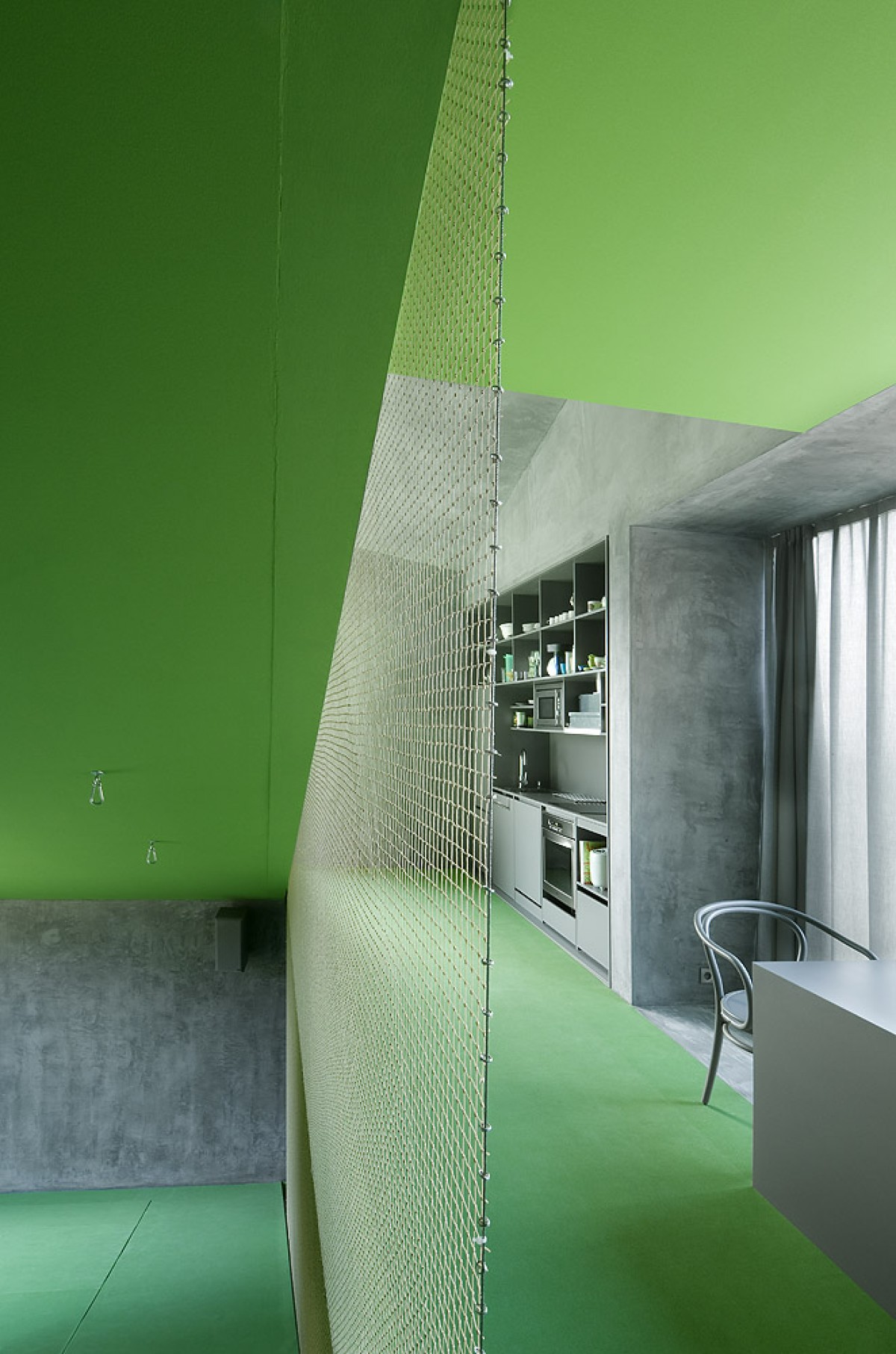 Slide Down the Steeply Slanted Floors of This Hillside Home Designs